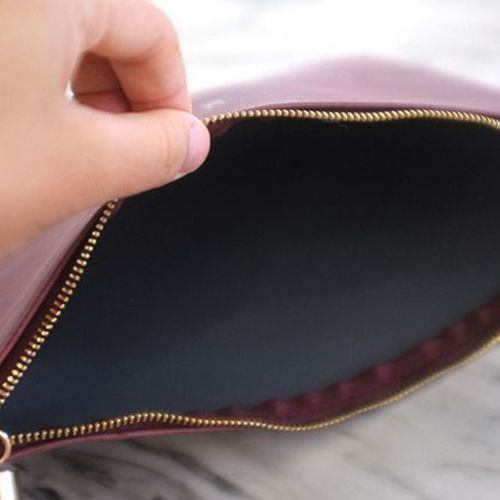 Lookit Tassel Leather Clutch